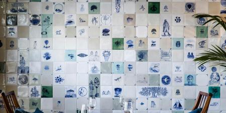Artistic tiles on a wall in a restaurant